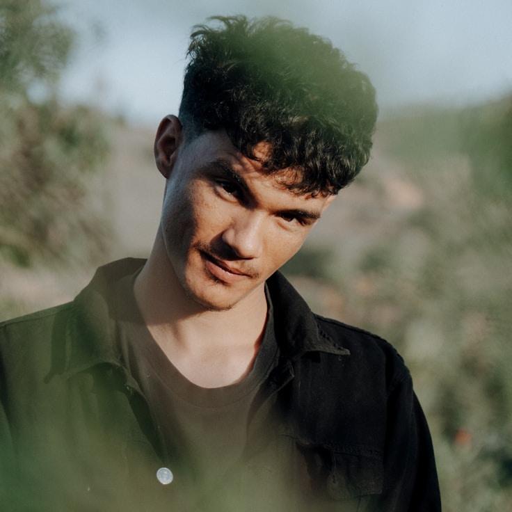 Kaveri Mehta, Lead Design Curator at Forest Pixel Grove, reviewing corporate floral arrangements